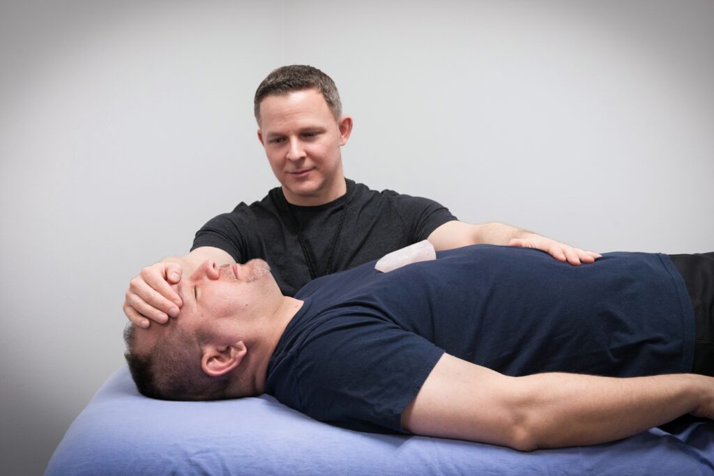 Michael Elder LMT and Reiki Master performing restorative touch through his Reiki mastery